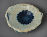 Base fragment of a bowl with rosette