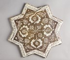 Star tile with vegetal and calligraphic decoration