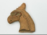 Head of a griffin from a vase handle