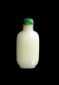White jade snuff bottle with jadeite stopper