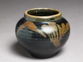 Black ware jar with leaf design