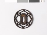 Tsuba with petals and sword-blades