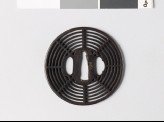 Round tsuba with cobweb design