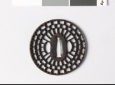 Round tsuba with radiating floral design