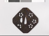 Tsuba with cherry blossoms and a cobweb