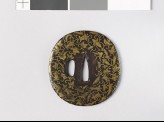 Lenticular tsuba with leaves and flowers