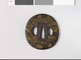 Tsuba with seashells amid water