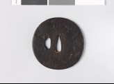 Round tsuba depicting a sea shore under cloud