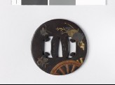 Tsuba with plants, butterflies, and chariot-wheels