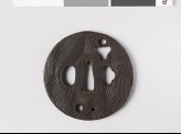 Round tsuba with wood grain decoration