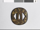 Tsuba with mitsudomoye, or three-comma shapes