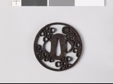 Round tsuba with mon crests of the Mayeda family