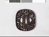 Tsuba with karakusa, or scrolling plant pattern