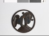 Tsuba with roof tiles depicting a demon mask and chrysanthemum (EAX.10457)