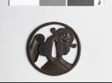 Tsuba with roof tiles depicting a demon mask and chrysanthemum