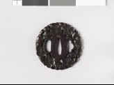 Round tsuba with plum blossoms