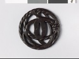 Round tsuba in the form of New Year straw rope (EAX.10514)