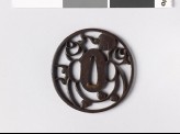 Round tsuba with tama, or sacred jewels