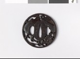 Round tsuba with stage props