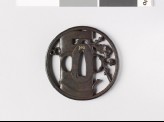 Round tsuba depicting a vase containing flowering plum twig (EAX.10616)