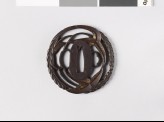 Round tsuba with arrowhead and Cissus leaves, and karakusa, or scrolling plant pattern