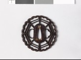 Tsuba with chrysanthemoid border enclosing a cobweb shape