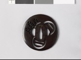 Lenticular tsuba with parts of three mon