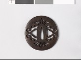 Lenticular tsuba with stylized flowers