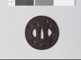 Tsuba with cherry blossoms falling towards a stream