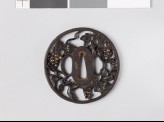 Round tsuba in the form of a grape vine