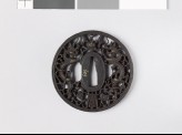 Tsuba with dragons and pearls amid karakusa, or scrolling plant pattern