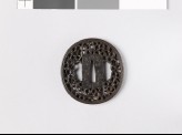 Tsuba with karakusa, or scrolling plant pattern