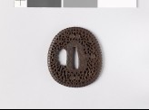 Lenticular, aori-shaped tsuba with floral scrollwork (EAX.10805)