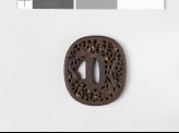 Tsuba with dragon amid scrollwork