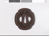 Mokkō-shaped tsuba with scrollwork and fish