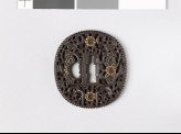 Tsuba with dragons amid scrollwork