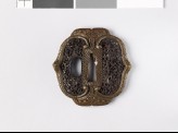 Mokkō-shaped tsuba with demon mask and dolphins