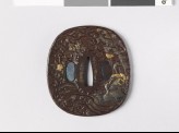 Tsuba depicting a swimming crane