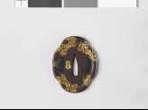 Mokkō-shaped tsuba with karakusa, or scrolling plant pattern, and mon made from kiri, or paulownia leaves