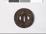 Round tsuba with heraldic leaves