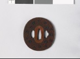 Tsuba with scrolls and mon made from kiri, or paulownia leaves