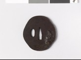 Mokkō-shaped tsuba depicting Seidzu Kwannon, a form of the Bodhisat Avalokitesvara (EAX.10988)