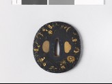 Lenticular tsuba with grasshopper, crickets, and autumn plants (EAX.11046)