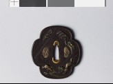 Mokkō-shaped tsuba depicting a tiger running by a stream (EAX.11069)