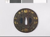 Round tsuba with flowers, foliage, and dragons