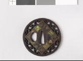 Round tsuba with flowers and scrolls