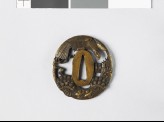 Tsuba with hawk flying above a plum tree