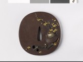 Tsuba depicting a warrior's helmet and plum branch (EAX.11241)