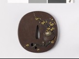 Tsuba depicting a warrior's helmet and plum branch (EAX.11241)