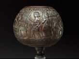 Coconut bowl on stand with procession of figures